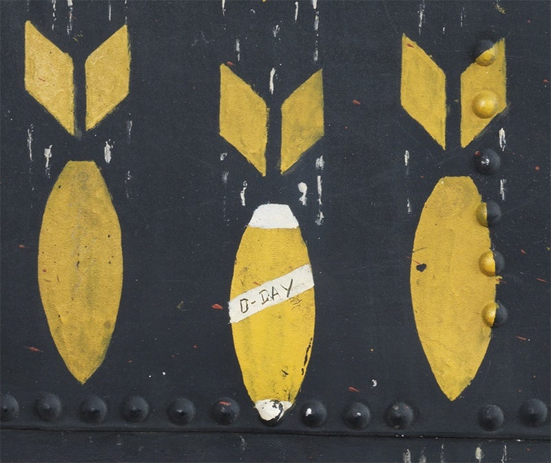 Yellow and white bombs painted on a WW2 bomber, at the Imperial War Museum in London