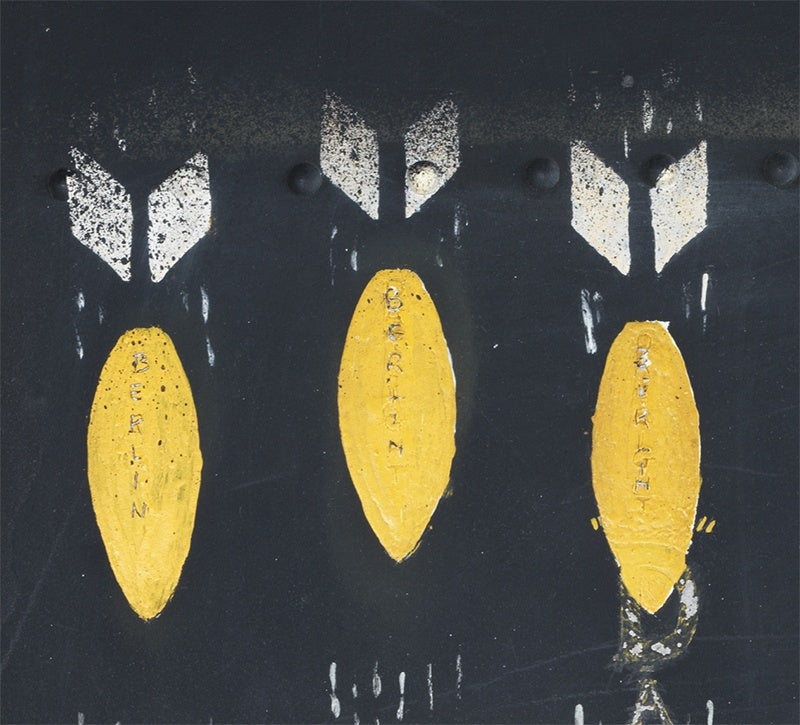 Yellow and white bombs painted on a WW2 bomber, at the Imperial War Museum in London
