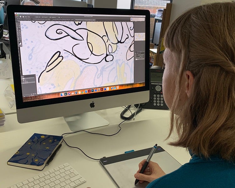 Folio Production Assistant, Allie, creating the line drawing for the slipcase of The Velveteen Rabbit