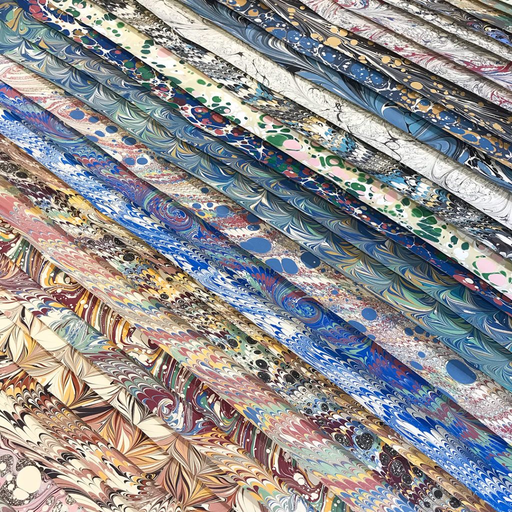 A range of different marbled papers by artist Jemma Lewis